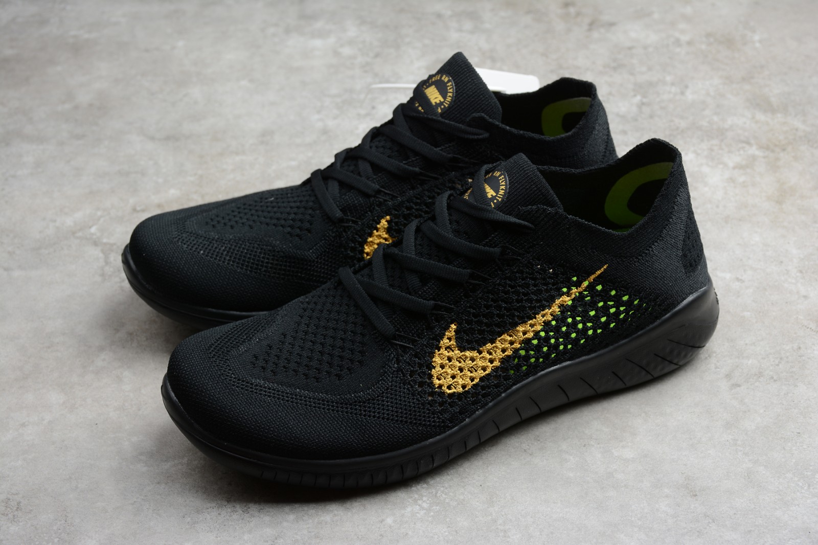nike free rn black and gold